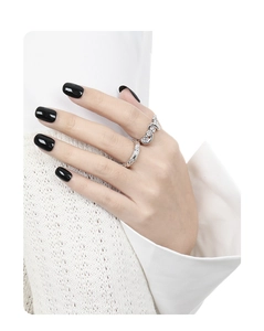 Detailed view of stackable S925 silver rings with wave design and shimmering zircon stones