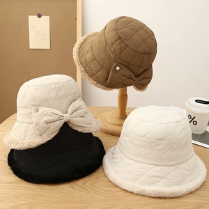 Quilted winter bucket hat with bow and fleece trim in khaki, beige, black and white