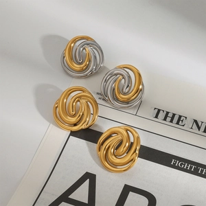 Elegant 18k gold plated spiral twisted knot stud earrings for women set on newspaper