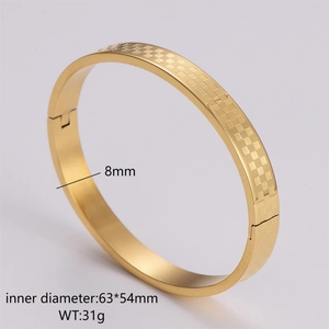 Detailed view of 8mm golden stainless steel bangle with classic checkered engraving