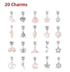 Macro view of 20 silver and pink enamel charm pendants featuring unicorn and heart motifs