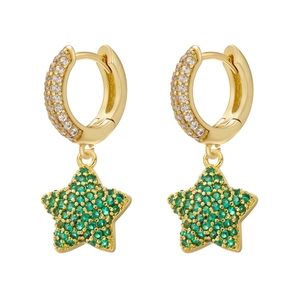 Close-up of gold star earrings with green micro-pave stones and sparkling hoop design