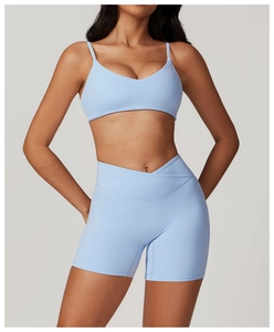 Detail of light blue seamless yoga bra with slim straps and V-neckline sport top