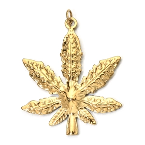Macro shot of gold cannabis leaf pendant with detailed leaf veins and polished finish