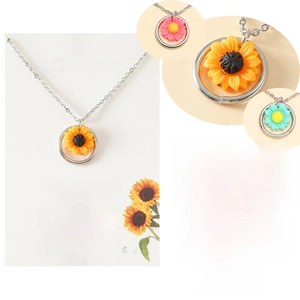 Detail of colorful resin sunflower pendant on stainless steel ring necklace