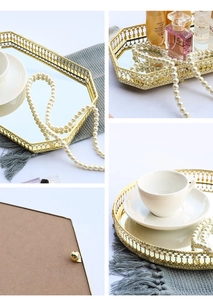 Close-up of golden geometric metal frame and reflective glass mirror surface detail