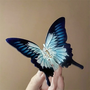 Détails de la pince à cheveux papillon avec texture en résine à dégradé bleu vif