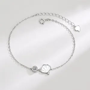 Detailed shot of S925 silver shell bracelet with zircon pendant and heart charm