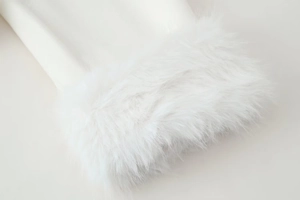 Detailed macro view of pure white wool coat sleeve with luxurious faux fur trim detail