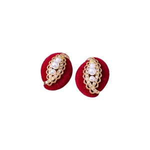 Elegant gold plated oval stud earrings with white pearl and sparkling crystals in red velvet