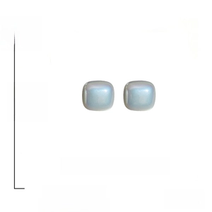 Detailed view of square faux pearl earrings with dimensions 2.5cm and 925 silver studs