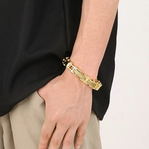 Men's gold steel motorcycle chain bracelet featuring industrial mechanical link design