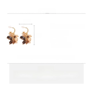 Detail showing tiger's eye earrings dimensions 4x2cm and material specifications