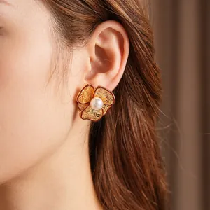 French vintage flower pearl earrings with gold woven texture and retro enamel details