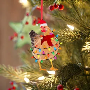Detail of Christmas rooster ornament with red scarf and Santa hat on a holiday tree