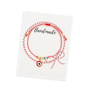 Handmade red and white braided evil eye bracelets with cross and gold bead accents