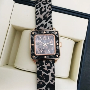 Close-up of square leopard print ladies watch with rose gold case in a display box