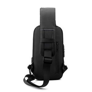 Waterproof black chest bag back view showing wide shoulder strap and hidden zipper pocket