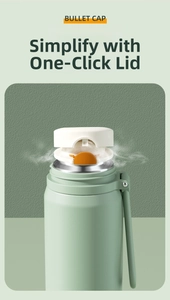Close-up of matte green stainless steel bottle featuring a white bullet lid with orange button