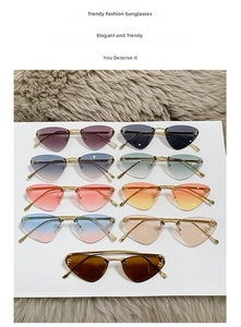 Close-up of heart-shaped rimless sunglasses in multiple colors with gold metal temples