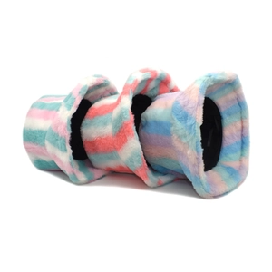 Three fuzzy rainbow striped bucket hats in pastel colors layered on a white background