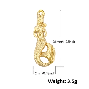 Detail of 18K gold plated mermaid pendant with size markings 31mm height and 12mm width