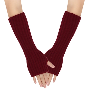 Detailed view of burgundy ribbed knit arm warmers with thumb holes and long sleeve style