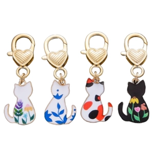 Set of four cartoon cat enamel charms with heart lobster clasps in floral patterns