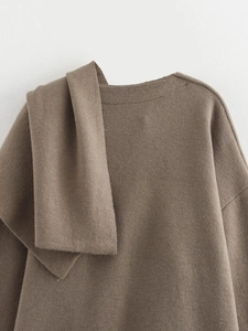 Close-up of the asymmetric folded collar detail on this soft brown knit cardigan