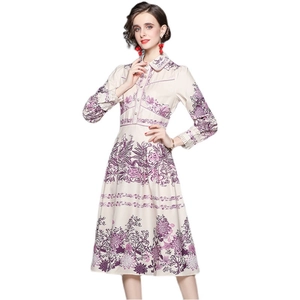 Elegant vintage long-sleeve midi shirt dress with purple floral prints and A-line silhouette