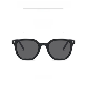Front view of square black sunglasses with gray lenses and silver rivets detail