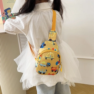 Detailed view of yellow kids chest bag with colorful cartoon car prints and strap