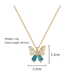 Macro shot of blue butterfly necklace with crystal inlay and technical measurements