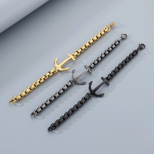 Detailed view of anchor bracelets in gold, silver, and black finishes on box chains