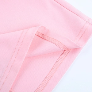 Detail of pink knitted fabric with high-quality double-needle stitching and smooth hem line