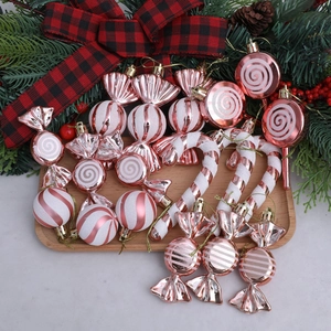 18-piece rose gold and white Christmas tree ornaments set on a wooden tray decor