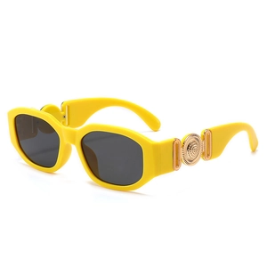 Retro small frame sunglasses with bright yellow thick rims and gold metal circle detail