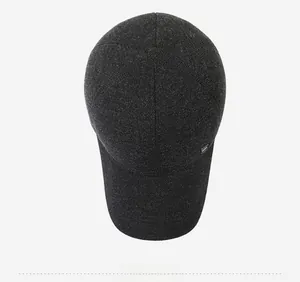 Top down view of a charcoal grey wool baseball cap with thick texture and metal detail