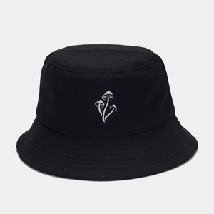 Close-up of white mushroom embroidery and stitching on black canvas bucket hat