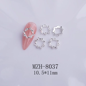 Macro view of MZH-8037 silver alloy nail art frames with vintage hollow carving details