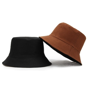 Classic cotton bucket hats shown in black and brown colors on a plain white background