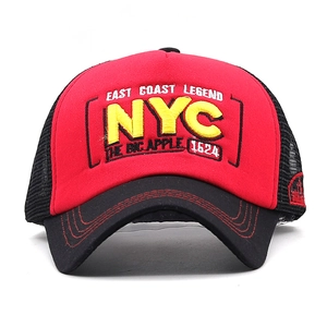 Close-up of 3D NYC embroidery and double stitching on red and black mesh trucker hat