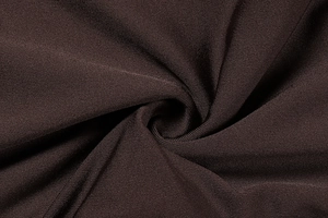 Macro detail of dark brown fine knit fabric showing textured ruffles and silky finish
