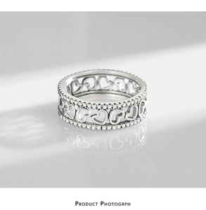 Detailed view of S925 sterling silver hollow heart ring with sparkling zirconia stones