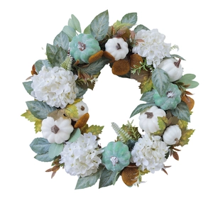 Fall wreath with white pumpkins, hydrangeas, and maple leaves for autumn door decor