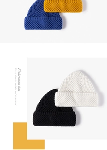 Detail of chunky knit fisherman beanies in four colors showing thick ribbed texture
