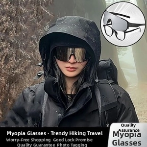 Outdoor close-up of rimless silver mirrored mountaineering sunglasses with over-glasses design