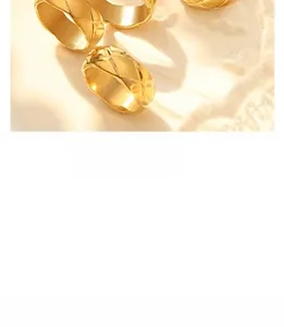 Detailed view of gold rings with classic matelassé quilted texture and reflective finish