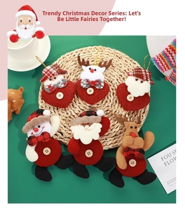 Detail of Christmas tree ornaments featuring Santa and reindeer with wooden buttons