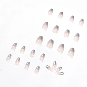 Short ballet-style silver mirror French press-on nails with nude base and metallic tips